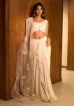 BEIGE EMBROIDERED BLOUSE WITH RUFFLE DRAPE SKIRT AND A ONE-SHOULDER FEATHER CAPE
